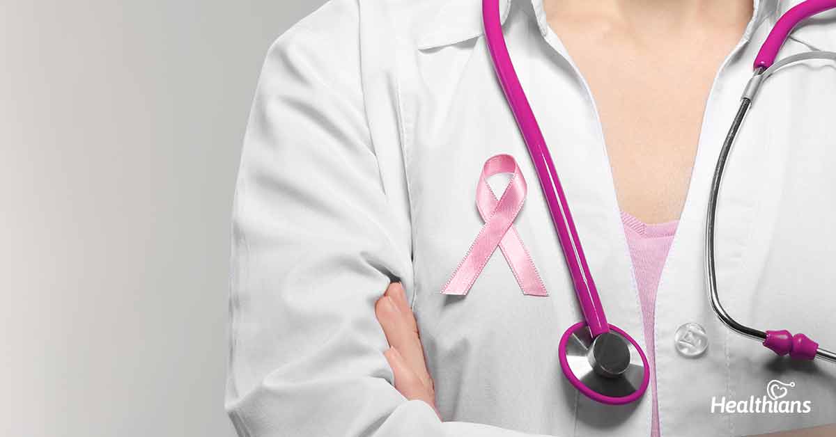 Female doctor with pink ribbon.
